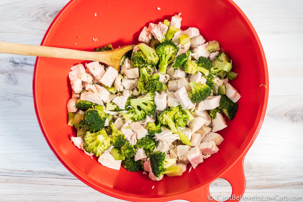 Chicken and broccoli in a mixing bowl