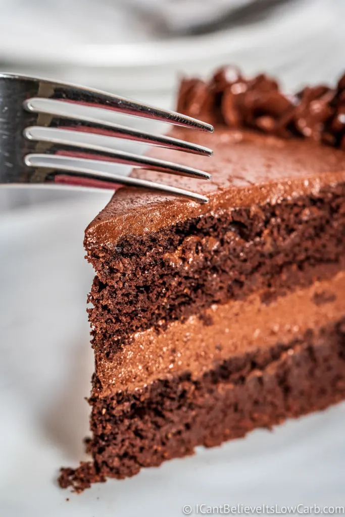 Cutting Keto Chocolate Cake with a fork