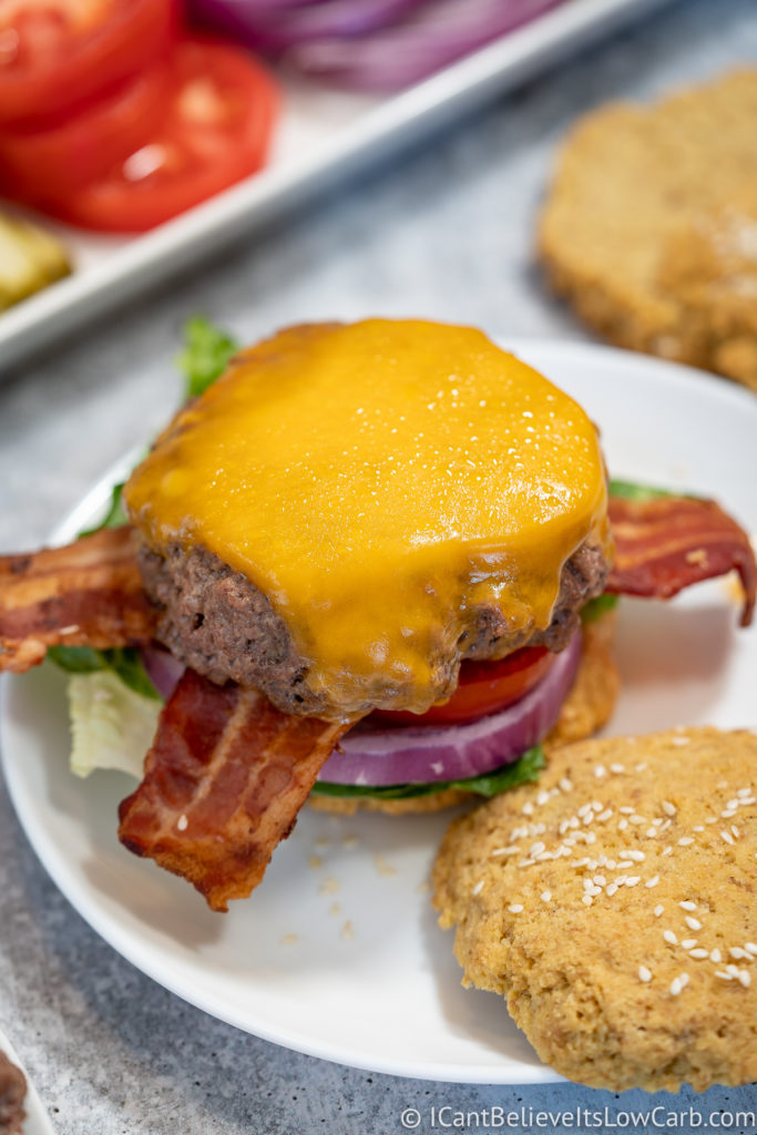 Juicy Hamburger on a bun with cheese and bacon