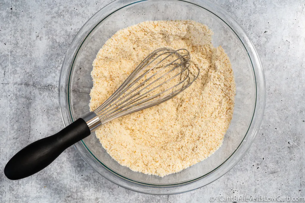 Mixing almond flour and ingredients with whisk