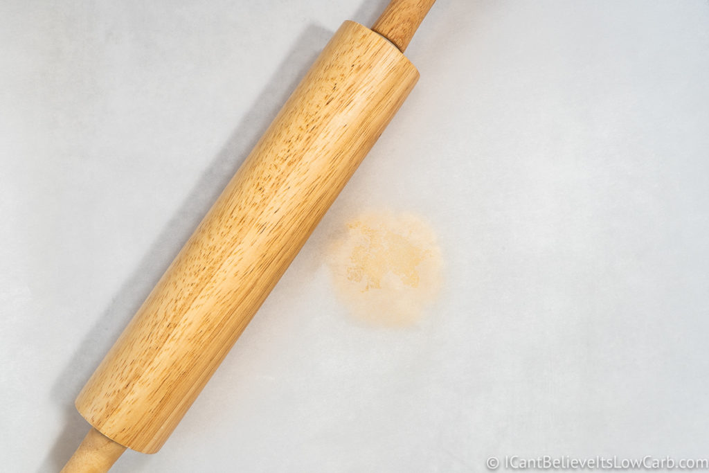 Low Carb Tortilla dough in between parchment paper