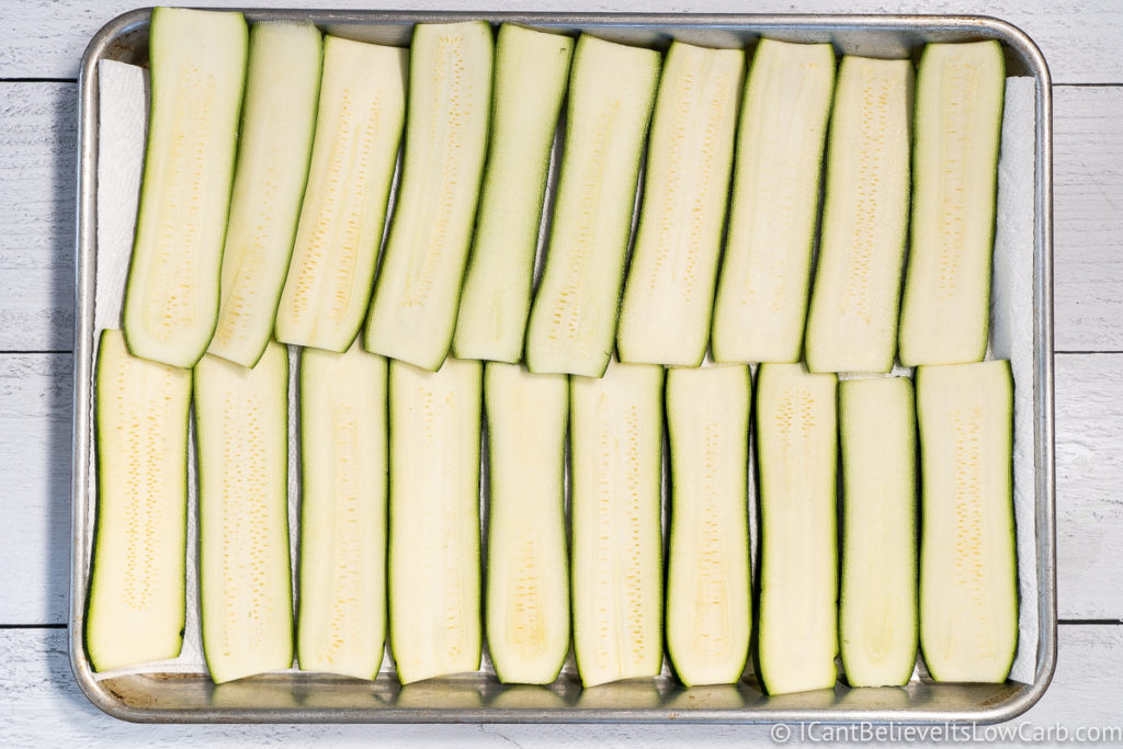 Zucchini Noodles laid out on a baking tray