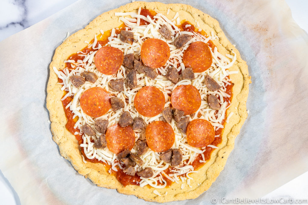 Almond Flour Pizza Crust with toppings before putting in the oven