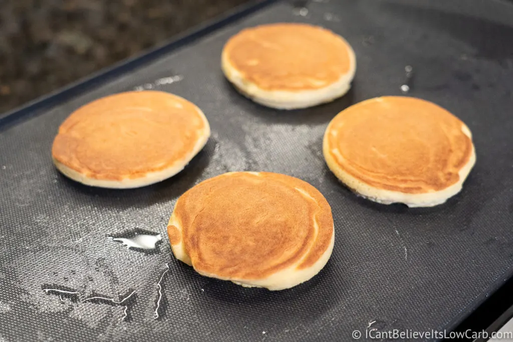 Cooked Coconut Flour Pancakes on the griddle