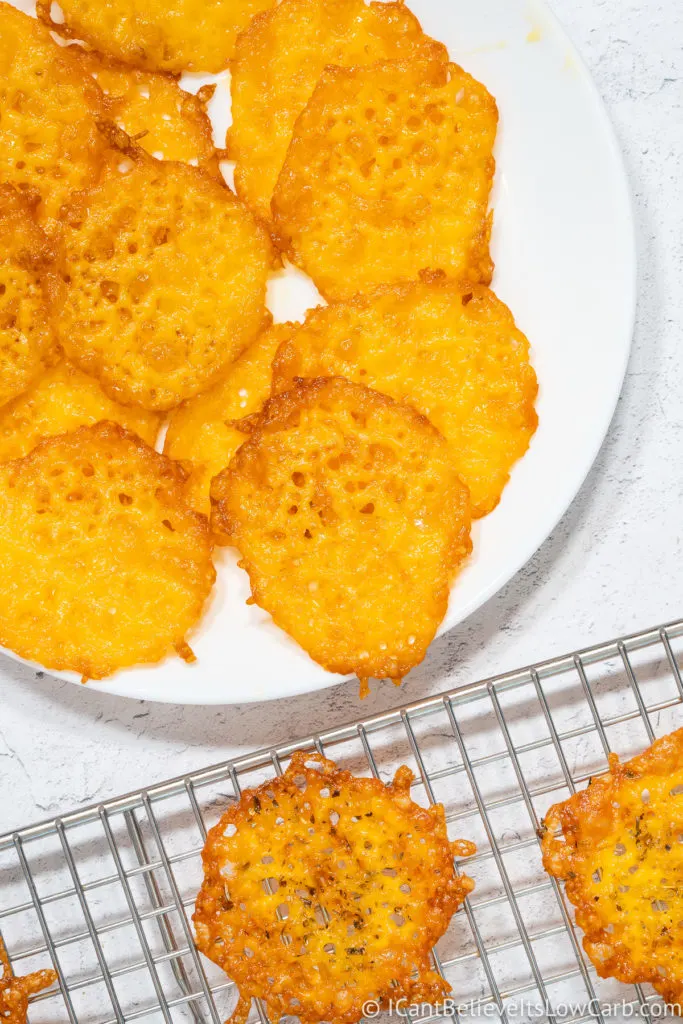 Keto Cheese Chips on a plate and cooling rack