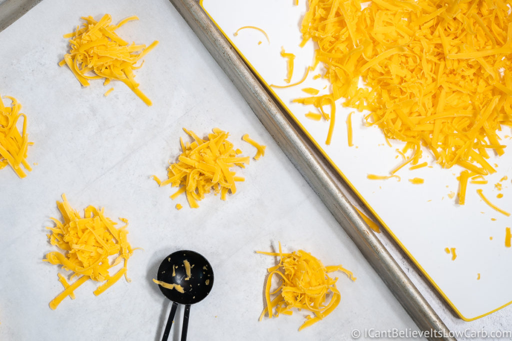 scooping cheese onto baking sheet