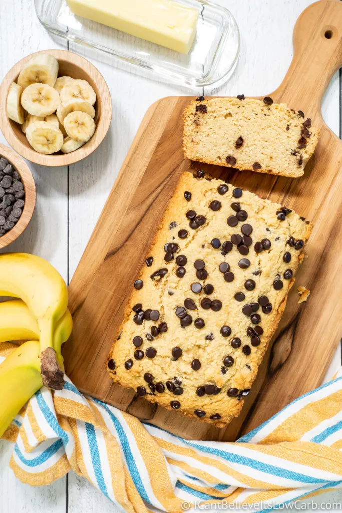 Keto Banana Bread on a cutting board with chocolate chips