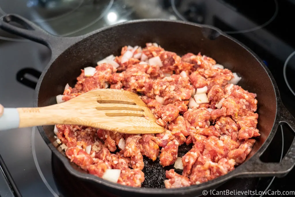 frying sausage in cast iron pan