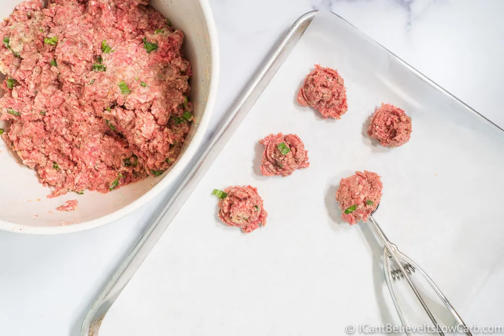 Scooping Meatballs out onto a tray