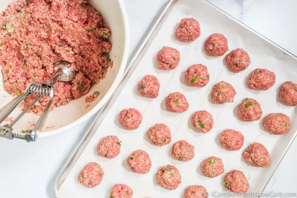 Rolling the Meatballs into balls on baking tray