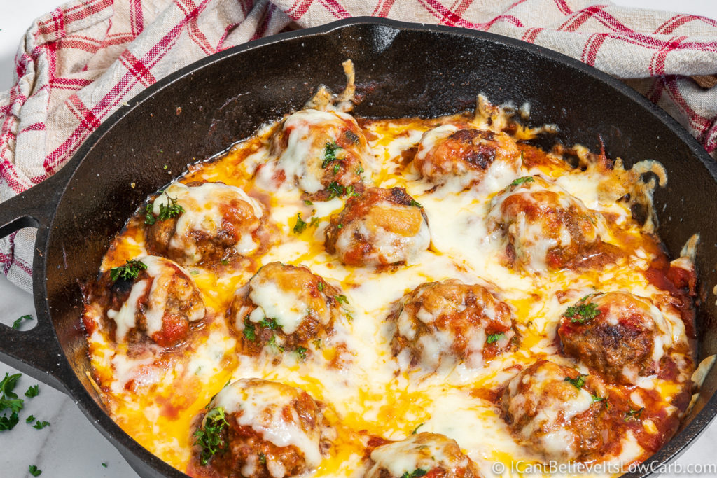 Keto Meatballs in a pan with mozzarella cheese