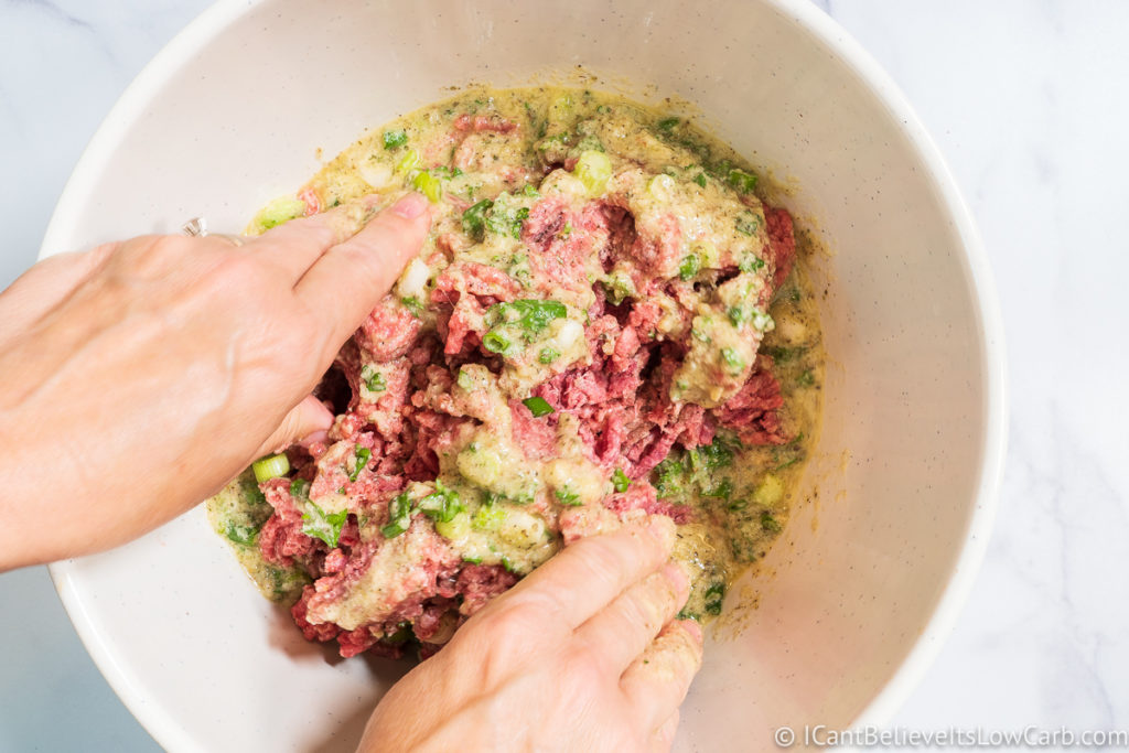mixing the meat for Keto Meatballs