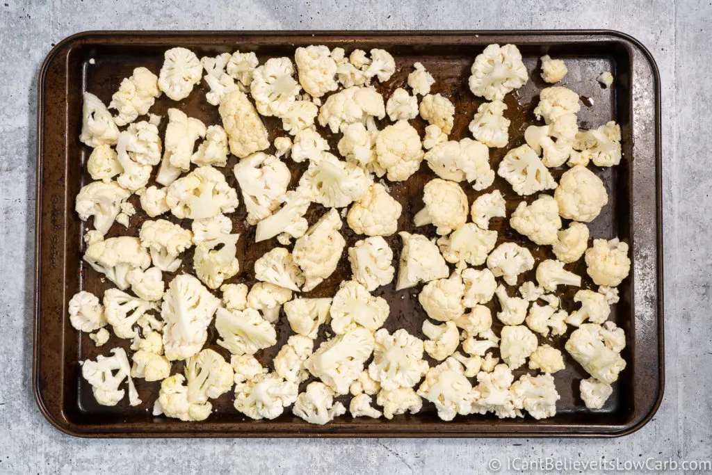 Cauliflower on a baking tray covered in olive oil