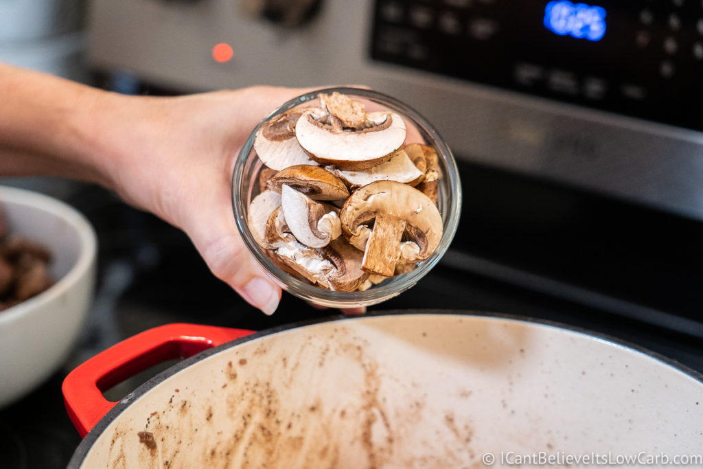 Adding mushrooms to the pan