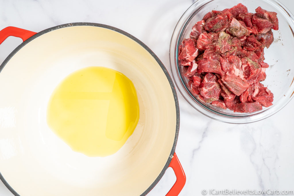 Dutch oven with olive oil and beef