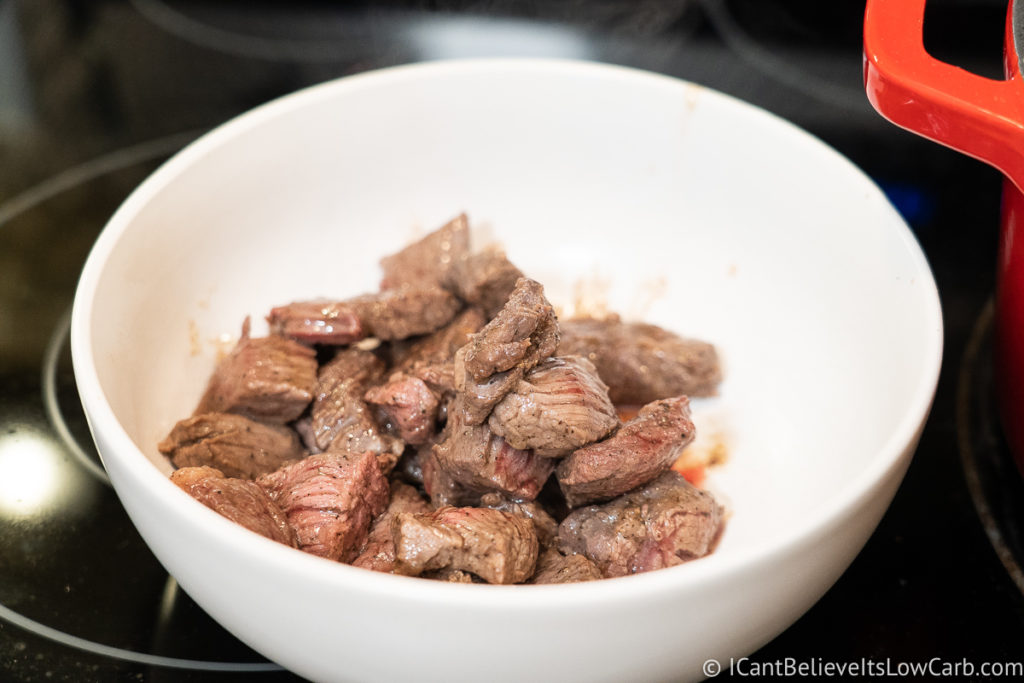 Cooked beef chunks in a white bowl