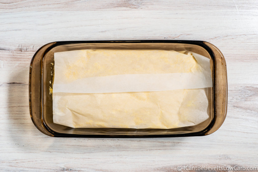 Folding the parchment paper over the bread