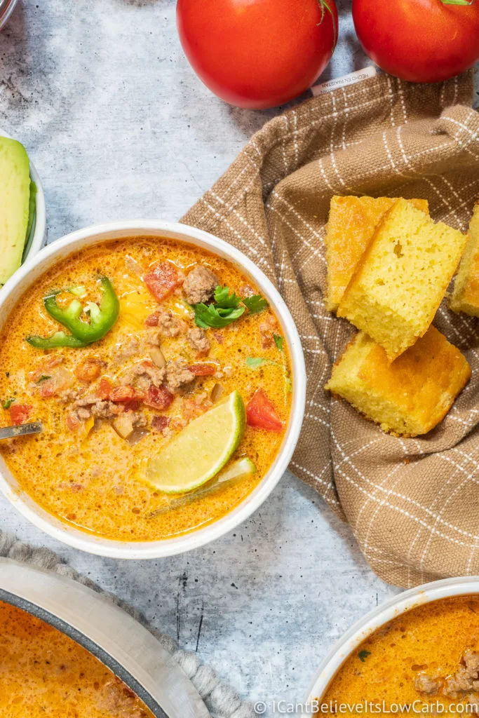 Bowl of Keto Taco Soup with cornbread on the side