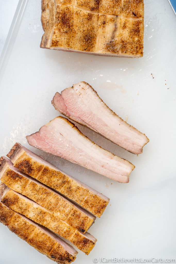 Roasted Pork Belly sliced on cutting board