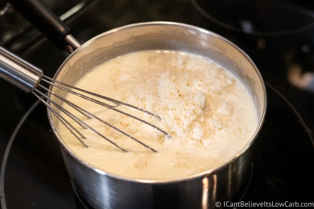 Mixing in the cheese in the Alfredo Sauce