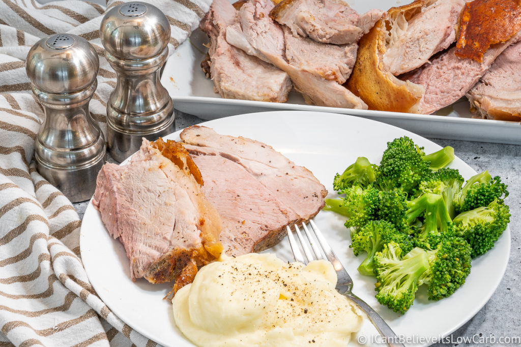 Baked Pork Shoulder on plate with broccoli and mashed cauliflower