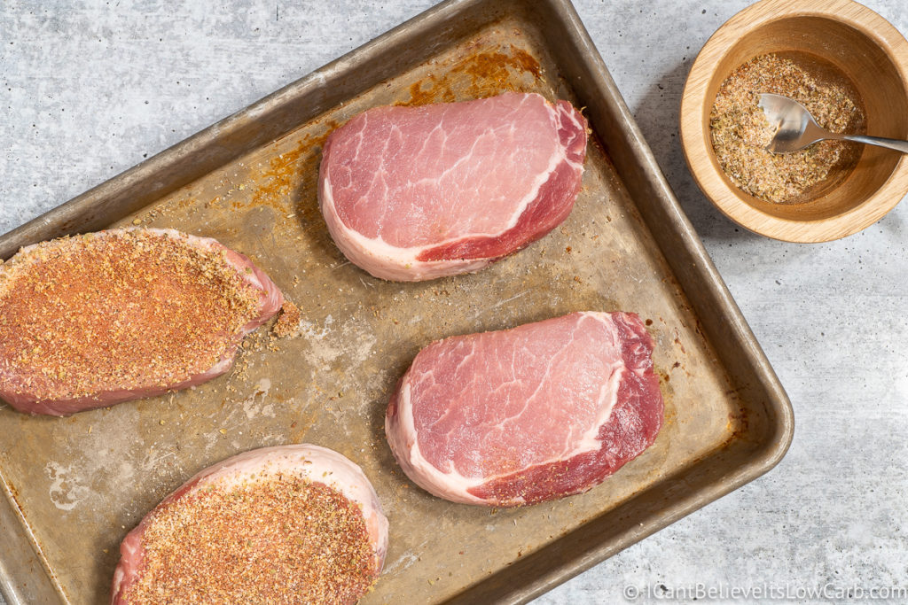 Putting spices on Pork Chops