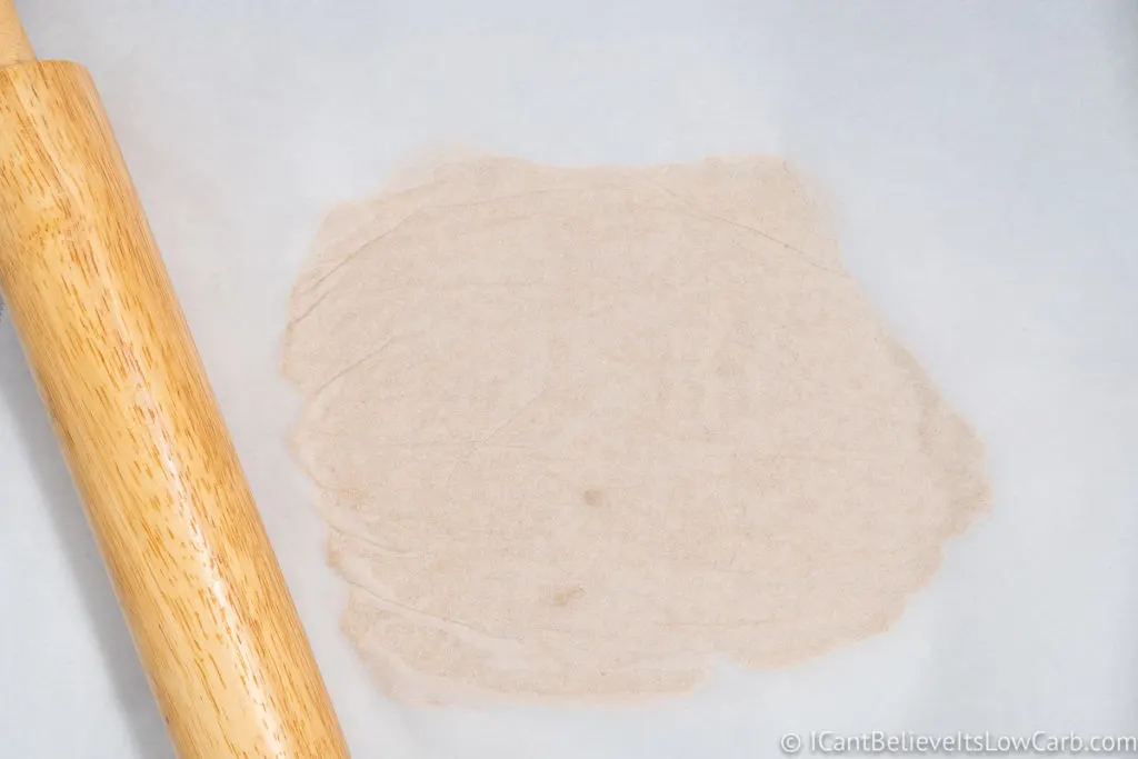 Flattening the coconut flour dough with a rolling pin