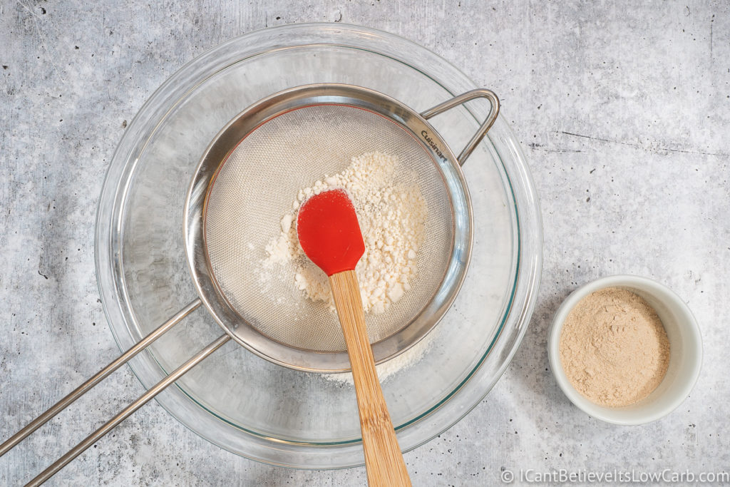Sifting Coconut Flour into a bowl