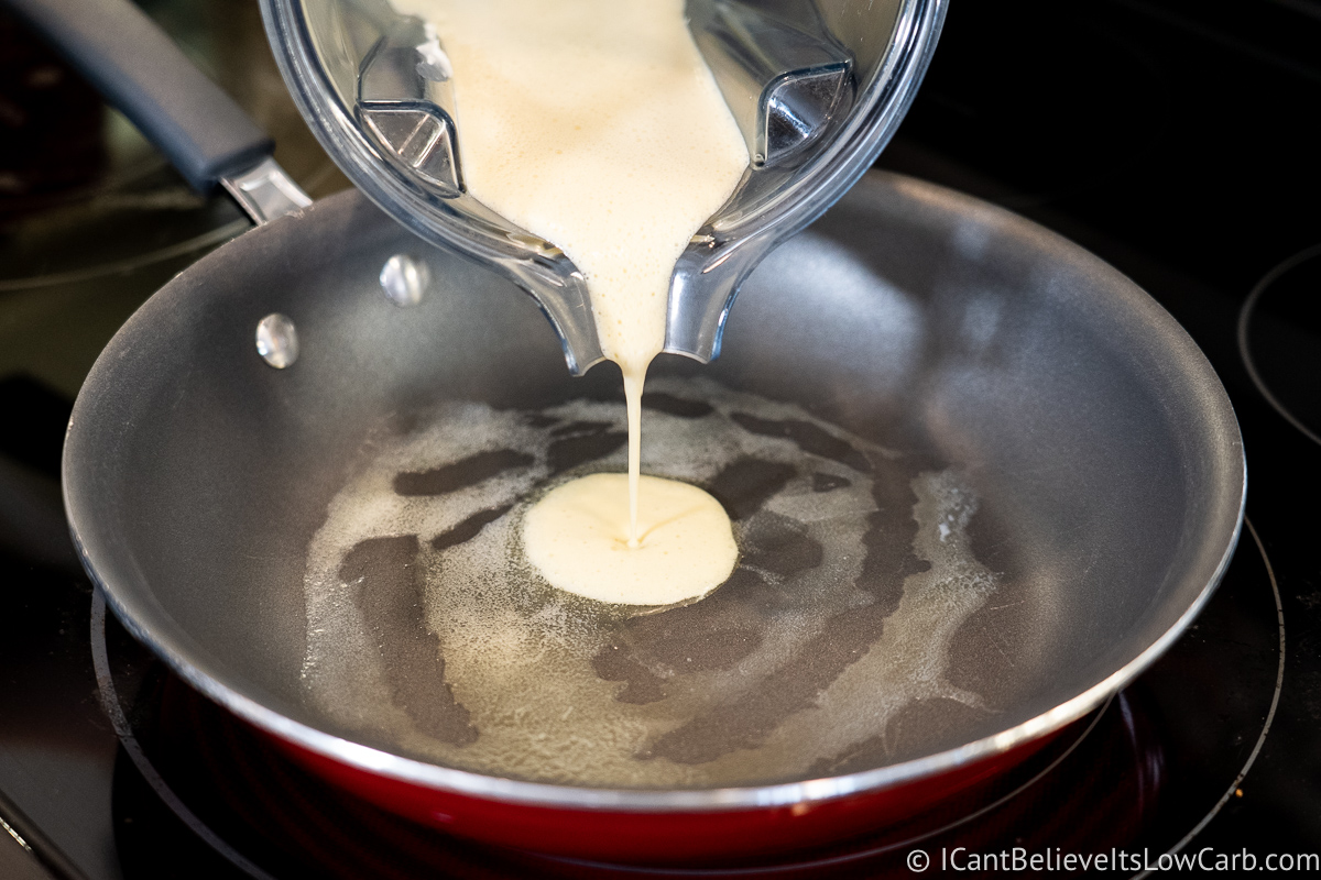 pouring cream cheese pancake batter in pan