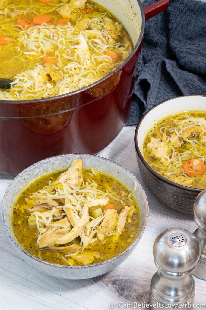 Keto Chicken Noodle Soup in two bowls and a pot