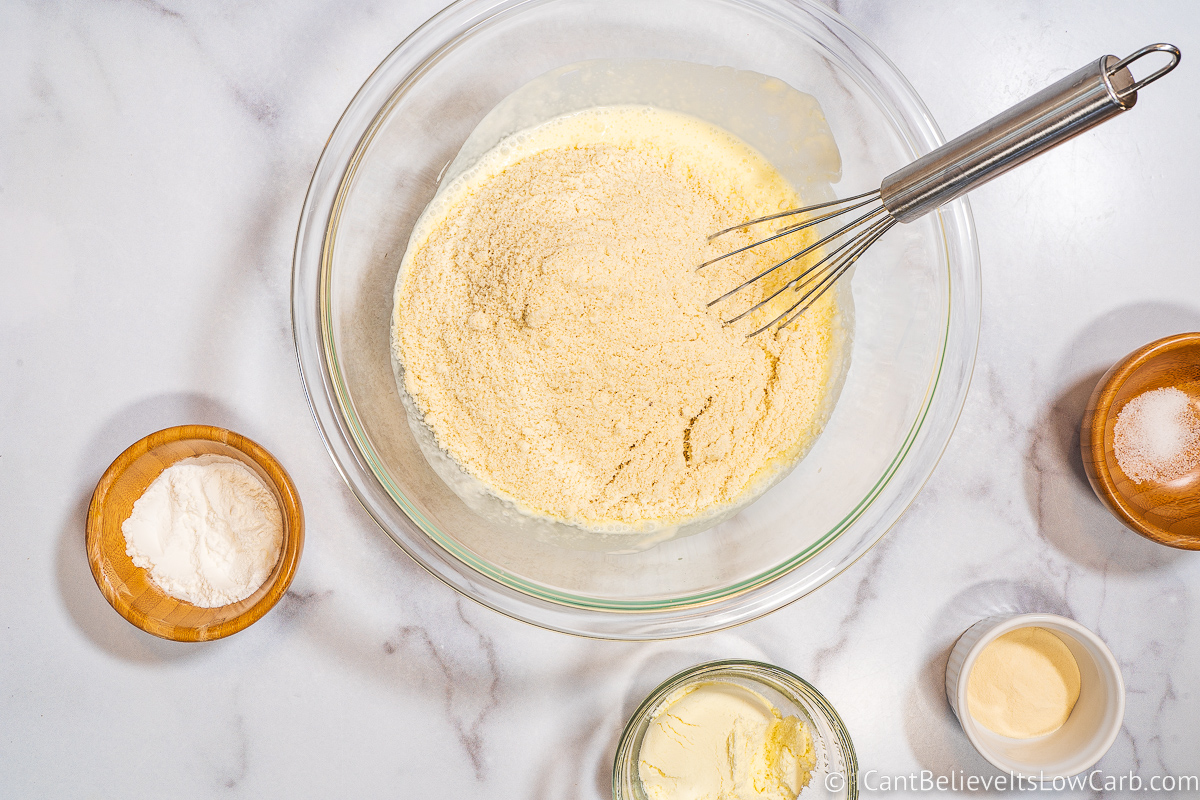 Adding dry ingredients to Keto Biscuits