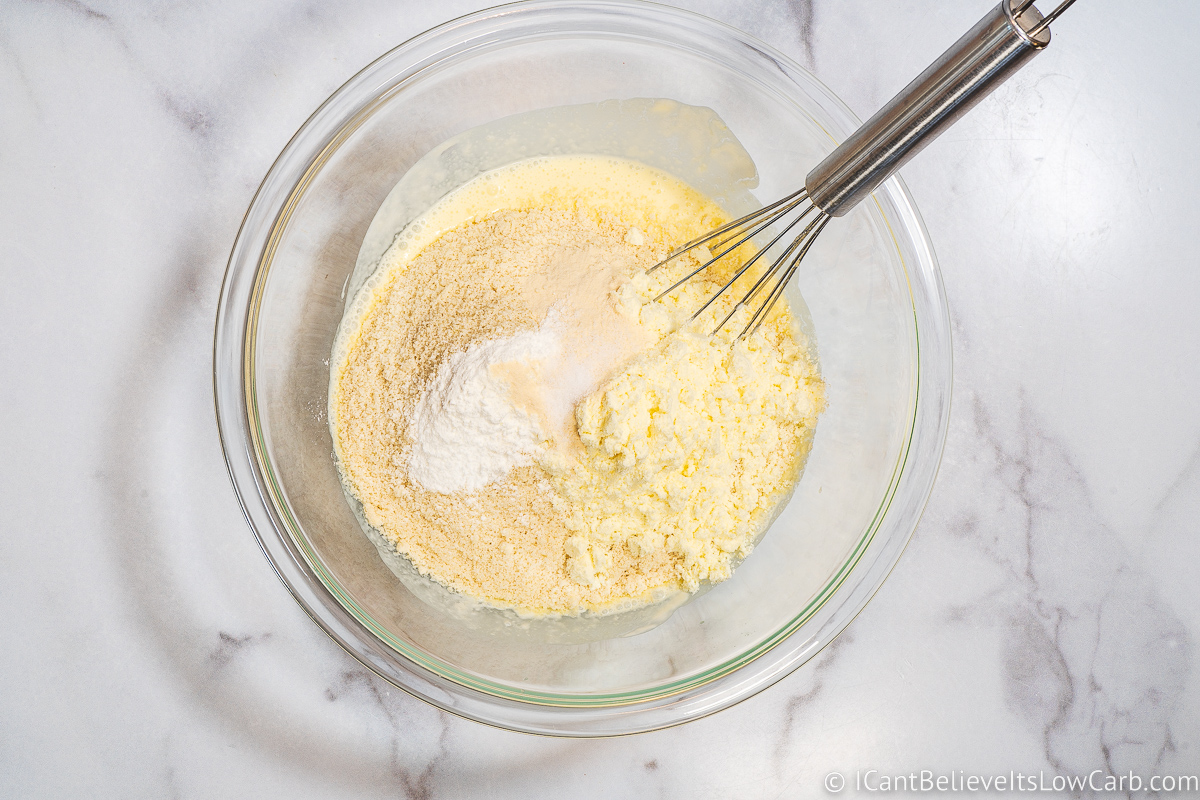 Adding dry ingredients to Keto Biscuits