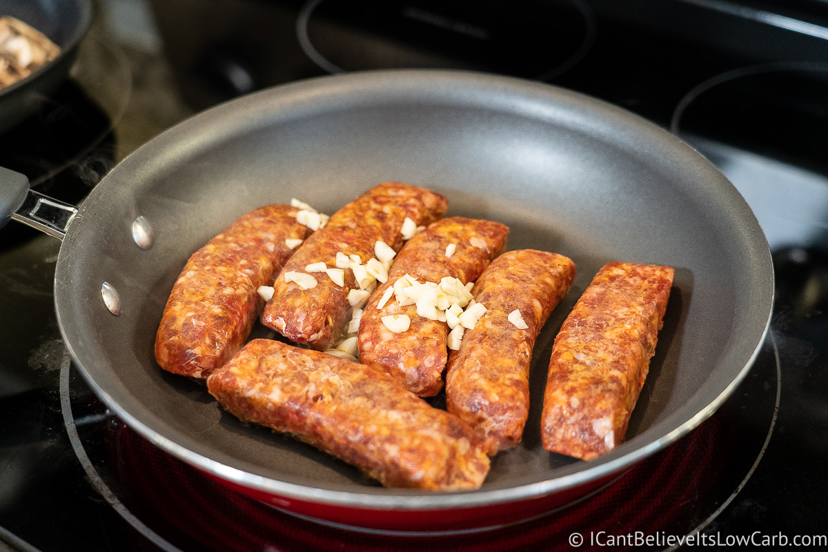 cooking sausage on the stove