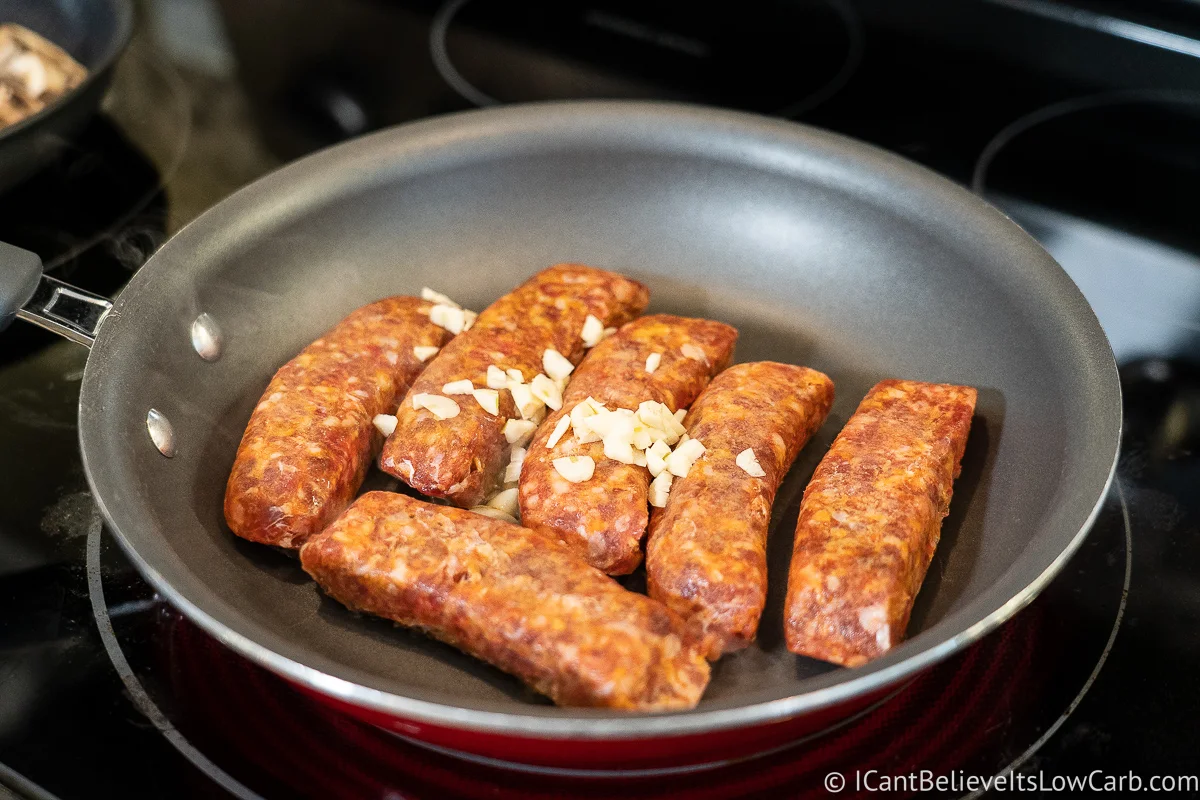 cooking sausage on the stove