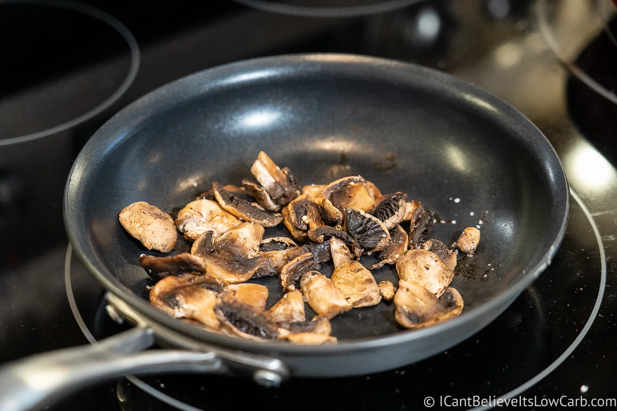 sautéing mushrooms in a pan